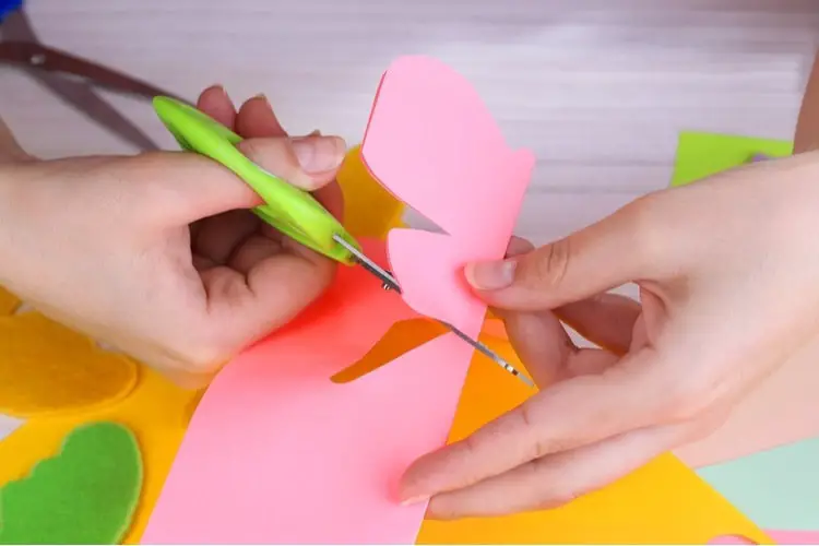 Person cutting with craft scissors