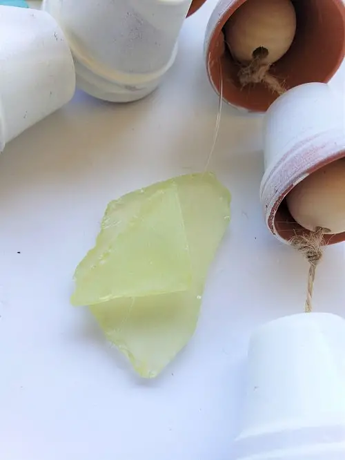 Gluing sea glass on the illusion cord