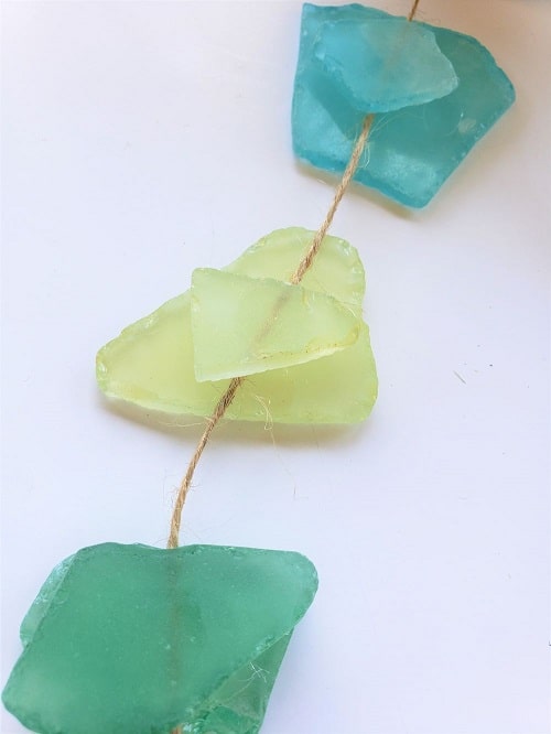 Glued pieces of sea glass on twine